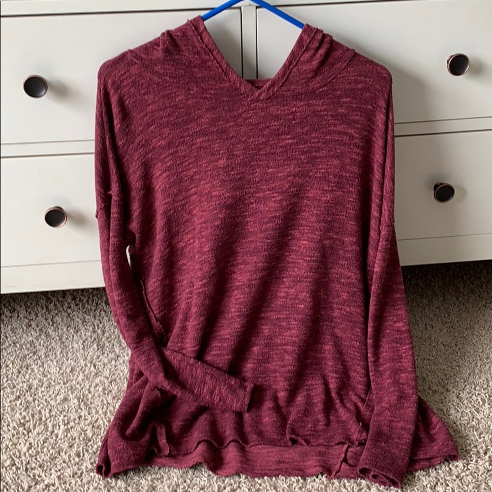 Long sleeve soft and plush hooded sweater.